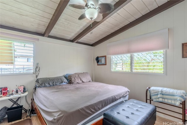 bedroom with vaulted ceiling with beams, ceiling fan, and wooden ceiling