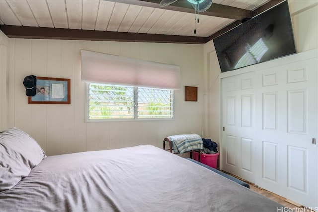 bedroom with beam ceiling and wooden ceiling