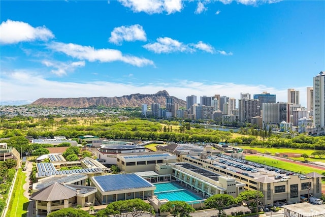 birds eye view of property with a view of city and a mountain view