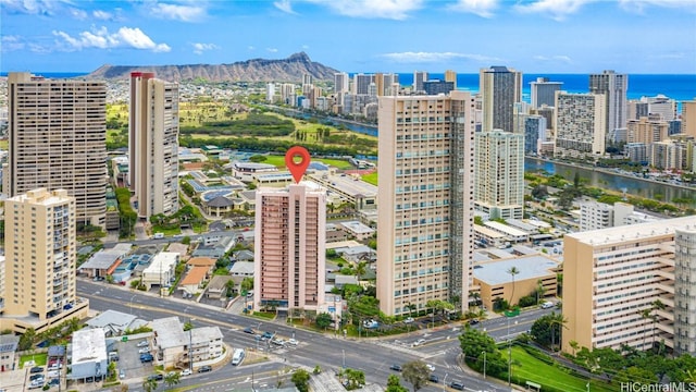 birds eye view of property with a view of city and a water view