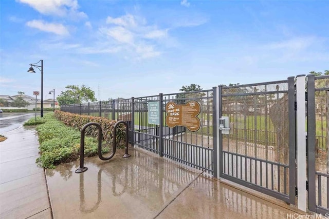 view of gate with fence