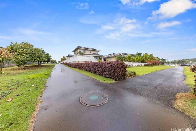 view of road featuring aphalt driveway