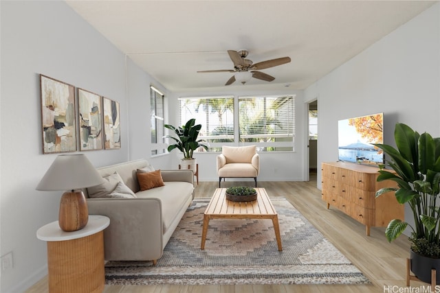 sunroom featuring a ceiling fan