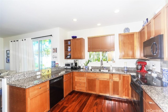 kitchen featuring dark wood finished floors, open shelves, stone countertops, a sink, and black appliances