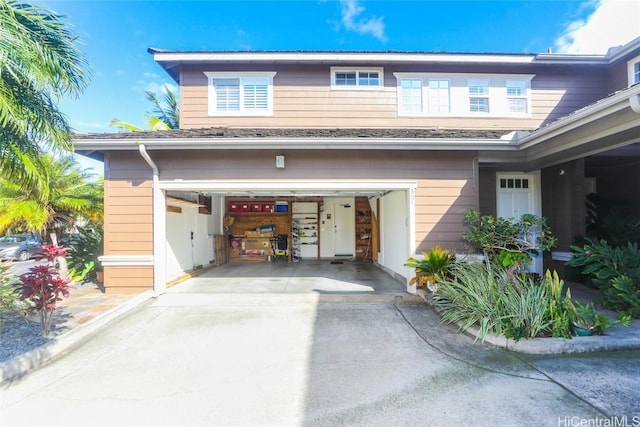 exterior space with a garage and concrete driveway