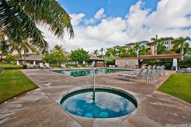 community pool with a community hot tub, a patio area, fence, and a pergola