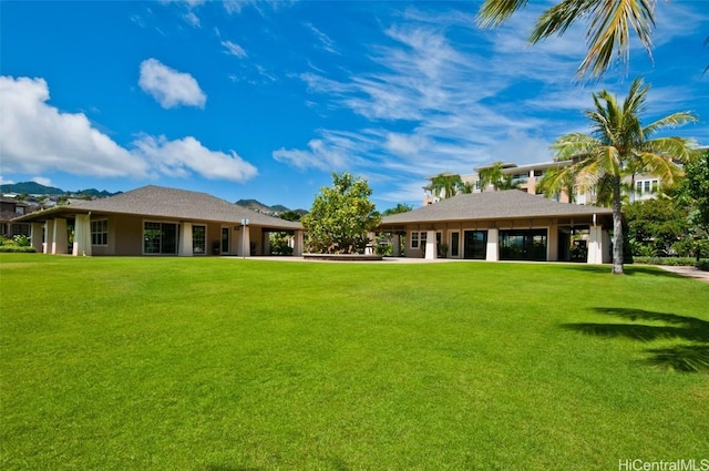 back of house with a yard