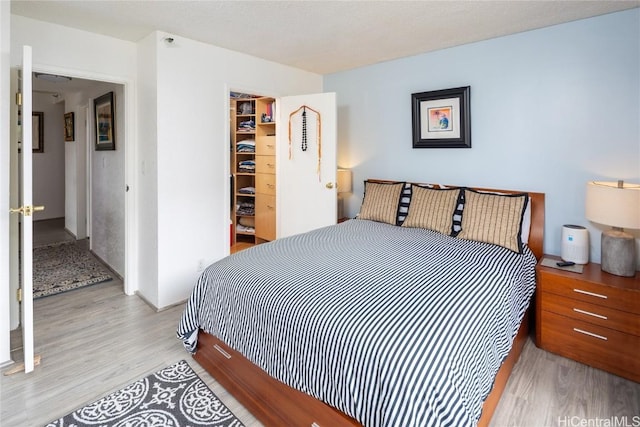 bedroom featuring a closet and wood finished floors