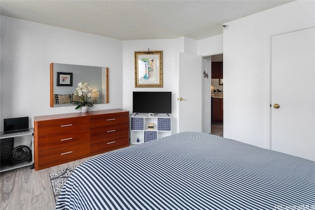 bedroom featuring light wood-type flooring