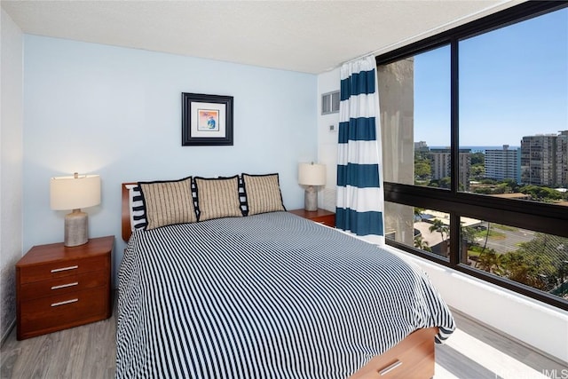 bedroom with wood finished floors