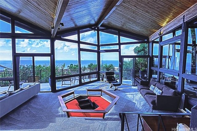 sunroom / solarium featuring a healthy amount of sunlight, wood ceiling, and lofted ceiling with beams