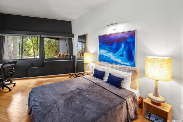 1826 Laukahi St, Honolulu, HI 96821 - bedroom featuring wood finished floors and a desk