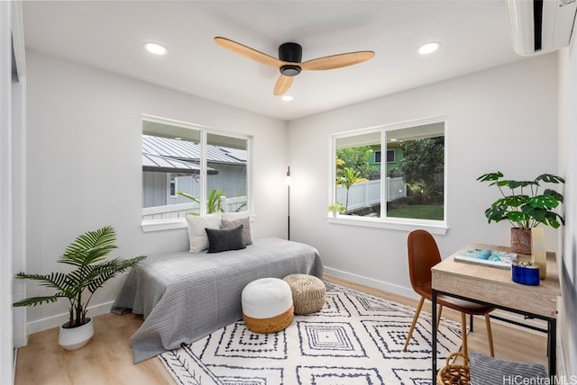 bedroom featuring light wood finished floors, recessed lighting, and baseboards