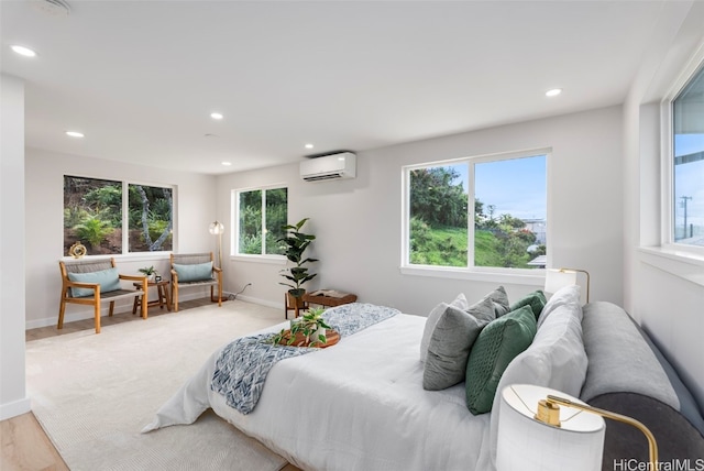 bedroom with recessed lighting, a wall mounted air conditioner, and baseboards