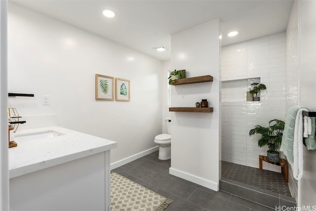 full bath with baseboards, toilet, vanity, a walk in shower, and recessed lighting