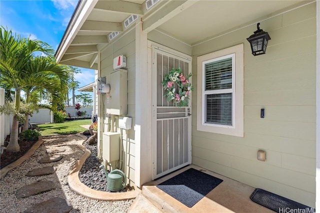 doorway to property featuring visible vents