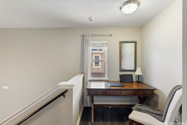 home office featuring wood finished floors and baseboards