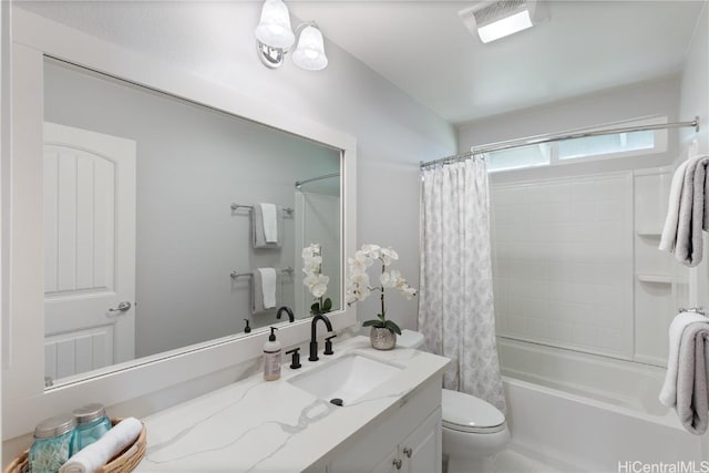 full bathroom featuring shower / bathtub combination with curtain, vanity, visible vents, and toilet