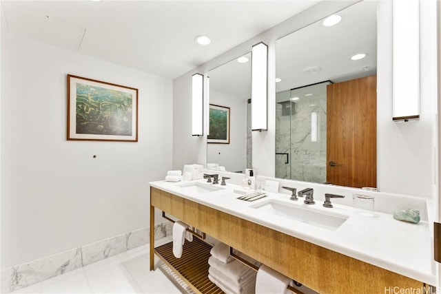 full bathroom with double vanity, recessed lighting, a stall shower, and a sink