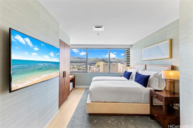 bedroom with wood finished floors