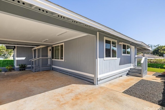 view of side of home with a patio area