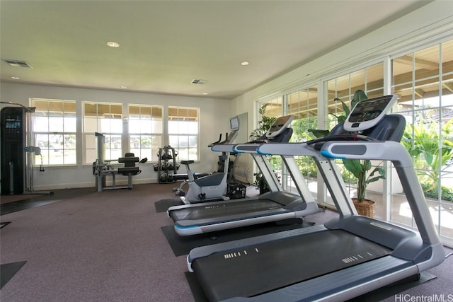 gym featuring baseboards, visible vents, and recessed lighting