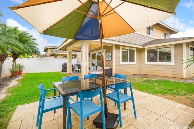 view of patio featuring outdoor dining space and fence