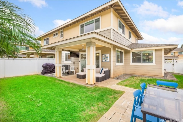 back of house with a yard, a patio, and a fenced backyard