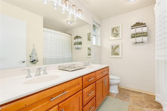 bathroom featuring double vanity, toilet, a shower with shower curtain, and a sink