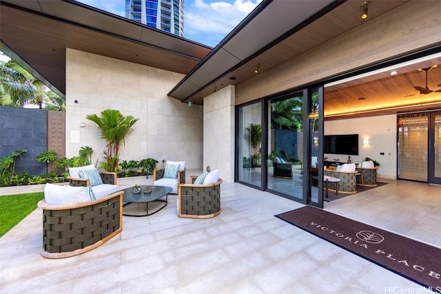 view of patio / terrace with outdoor lounge area and fence