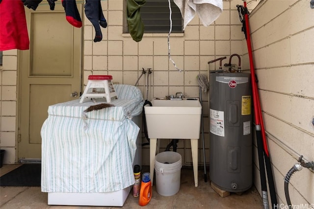 utilities with water heater and a sink