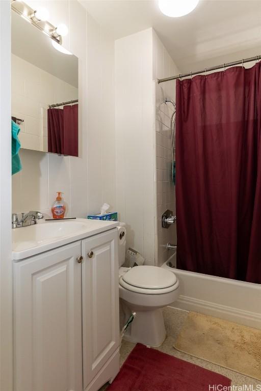 bathroom with shower / tub combo, tile patterned flooring, vanity, and toilet