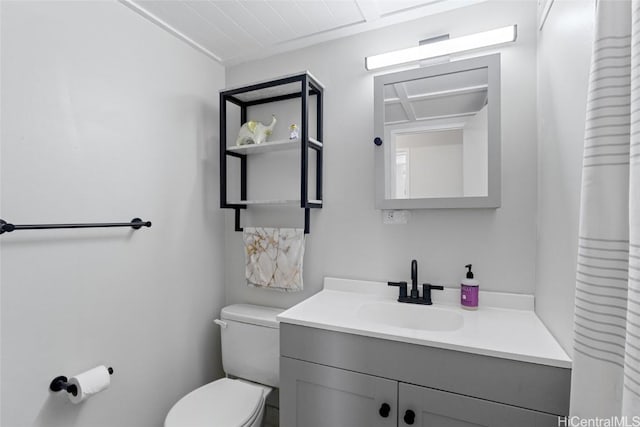 bathroom featuring toilet and vanity