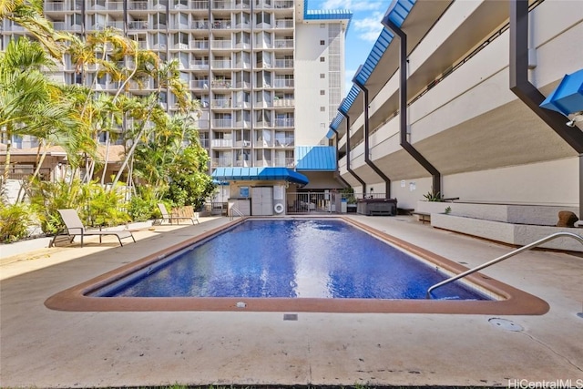 view of swimming pool with a patio area