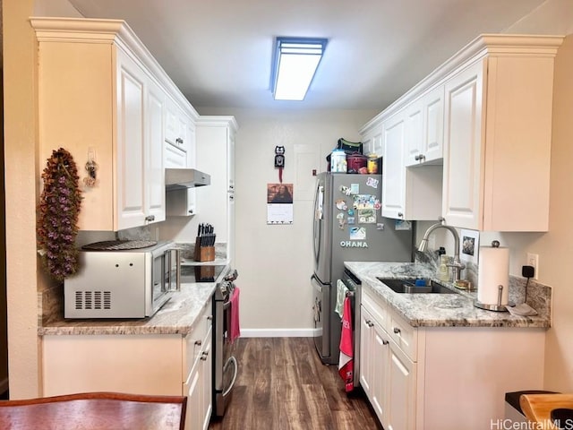 kitchen featuring white cabinetry, appliances with stainless steel finishes, and a sink