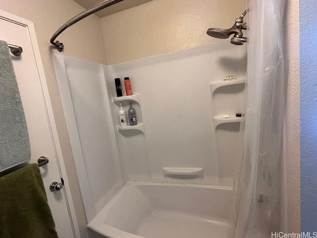 full bathroom featuring shower / bath combination with curtain