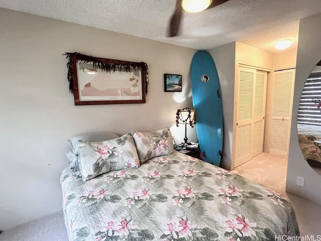 carpeted bedroom featuring a closet and a textured ceiling