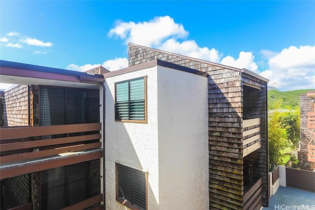 view of side of property featuring stucco siding