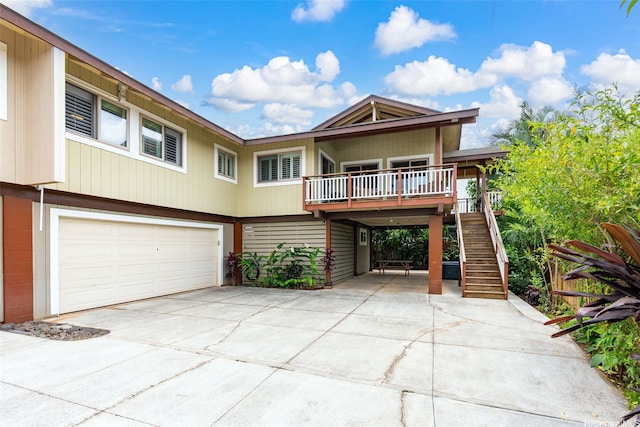 66-158A Haleiwa Rd, Haleiwa, HI 96712 - view of front of home featuring driveway, stairway, and a garage