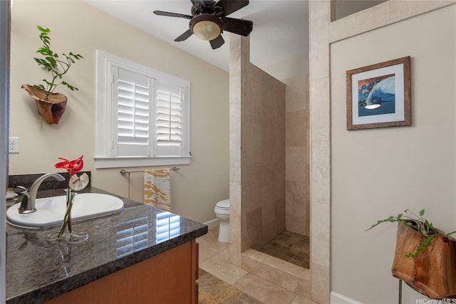 66-158A Haleiwa Rd, Haleiwa, HI 96712 - bathroom with toilet, ceiling fan, a tile shower, vanity, and baseboards