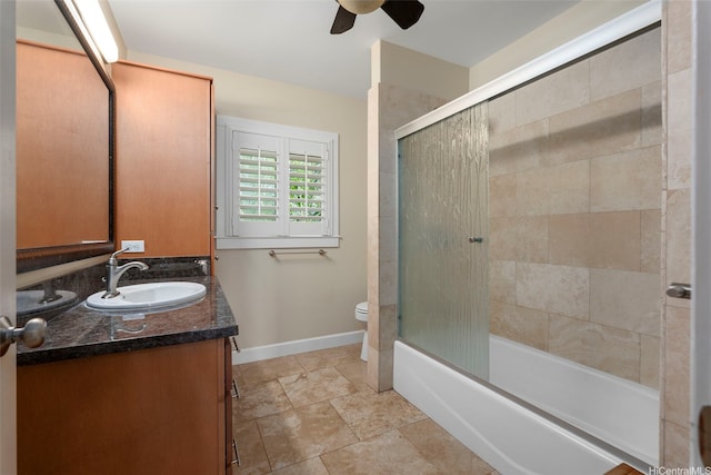 66-158A Haleiwa Rd, Haleiwa, HI 96712 - bathroom featuring a ceiling fan, vanity, baseboards, toilet, and enclosed tub / shower combo