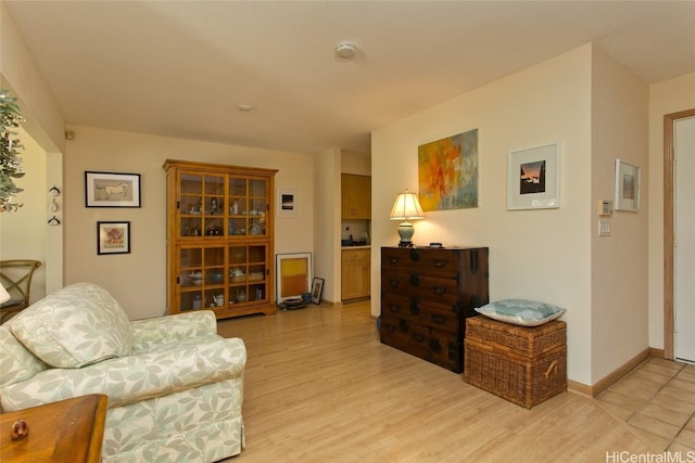 living room with light wood-style floors and baseboards