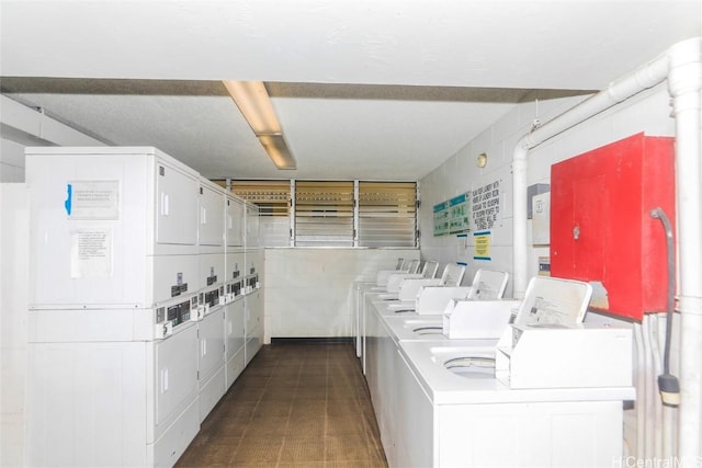 common laundry area featuring washer and dryer and stacked washer / dryer