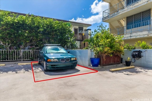 uncovered parking lot with fence