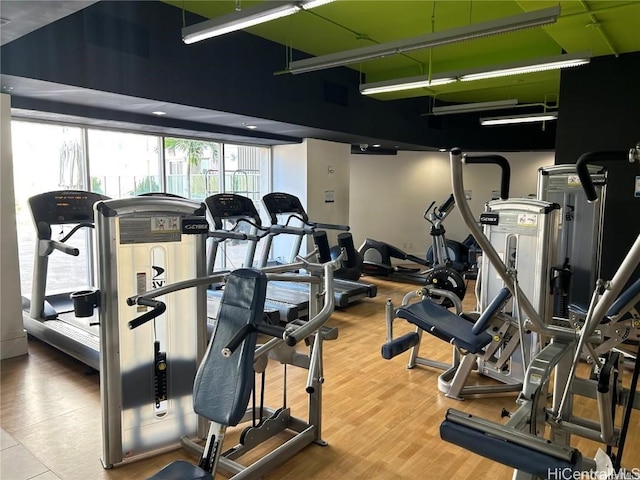 gym with wood finished floors