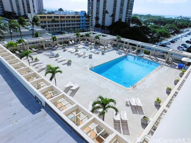 view of pool with a view of city