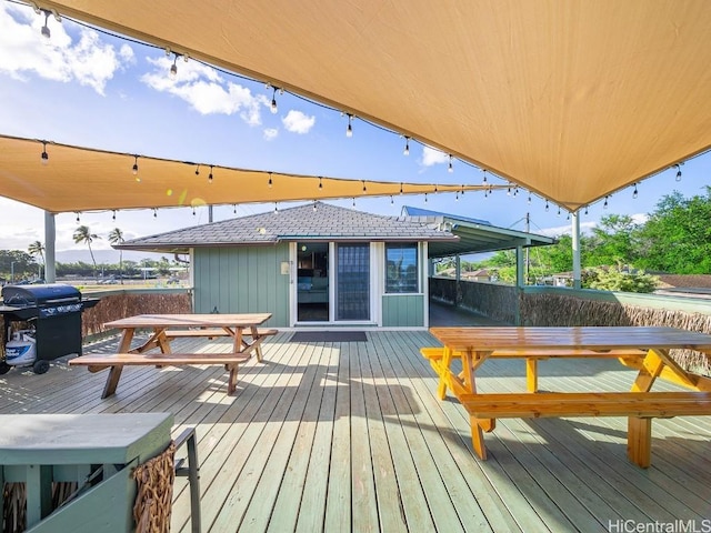 wooden terrace featuring area for grilling