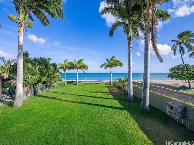 exterior space featuring a water view and fence