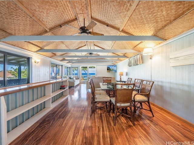 dining area featuring vaulted ceiling with beams, ceiling fan, and wood finished floors