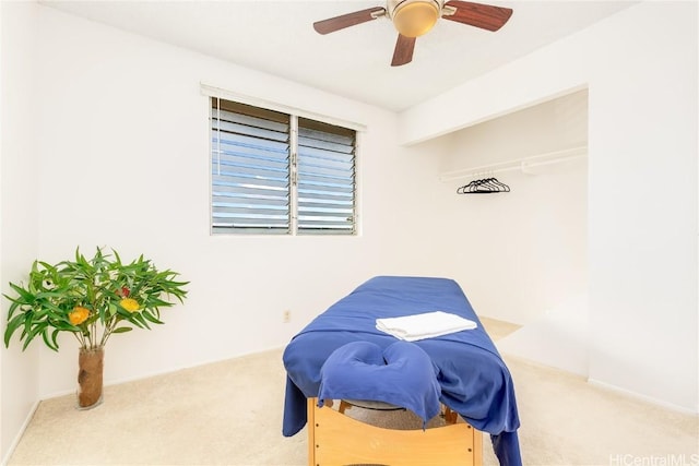 bedroom with baseboards, a ceiling fan, and carpet flooring